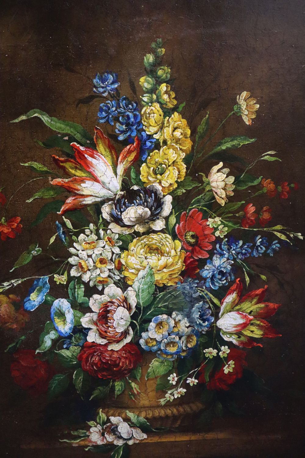 Continental School, oil on canvas, Still life of flowers in a vase on a ledge, 76 x 60cm